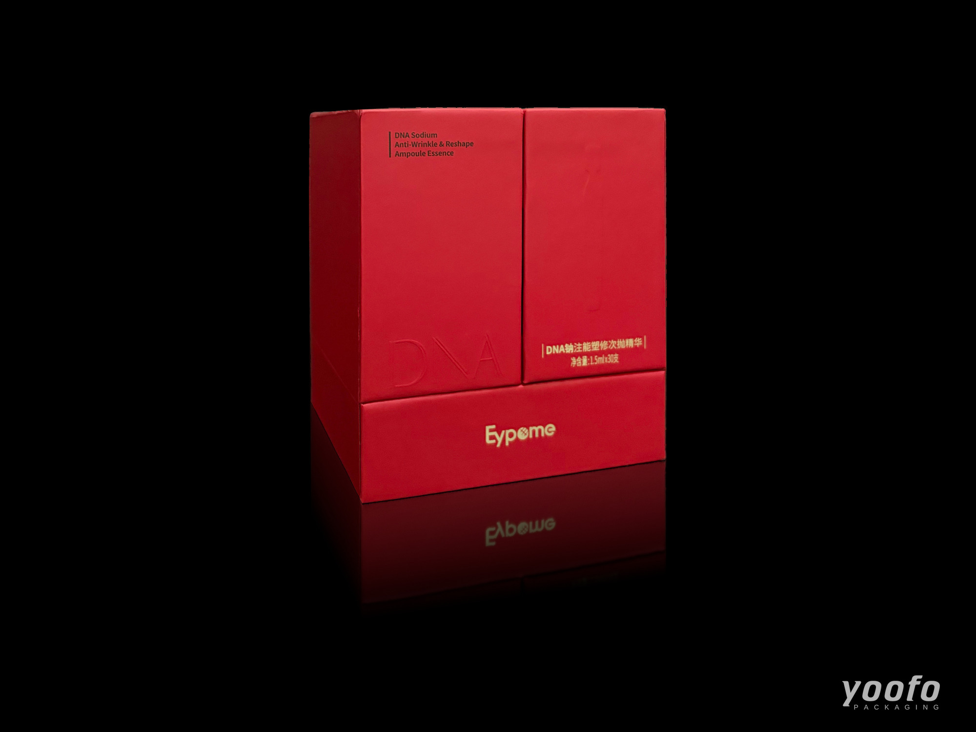 Red rigid cosmetic gift box with two front doors and gold foil text, closed, three-quarter view on black background